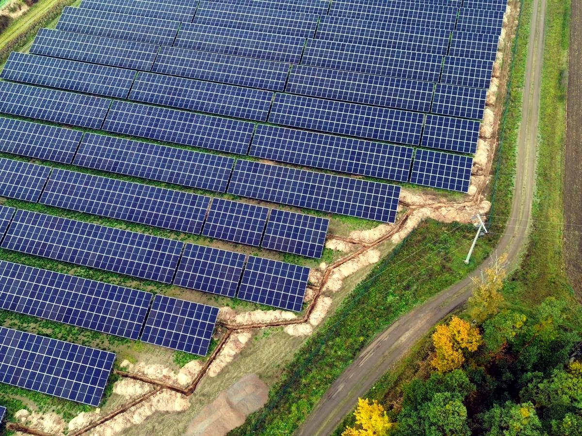 Completed PV farm — module rows from a drone