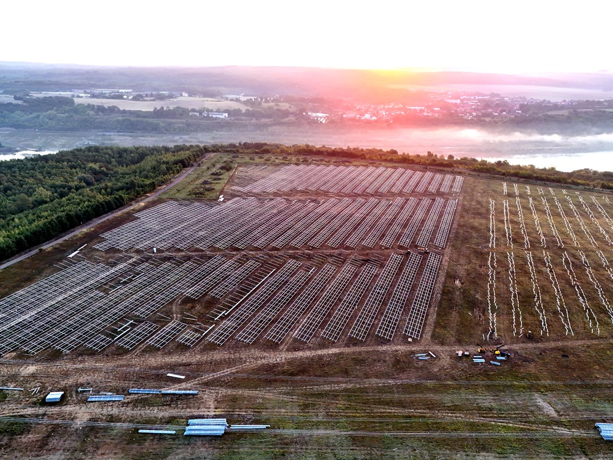 Structure assembly at sunrise — drone photo